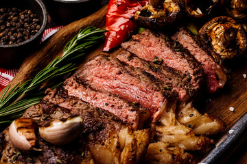 Top view of delicious grilled beef steak and vegetables served