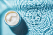 © mizina - cosmetic cream over blue water