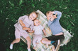 © nataliaderiabina - Children in nature. Preschool small kids play on green grass outdoors in summer. Siblings friendship. Holidays with family. Happy and healthy lifestyle. Minimalist style photo.