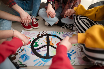 cut out of students praying for peace in world at school.