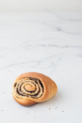 Wall Mural - Homemade poppy seed roll buns on a white table