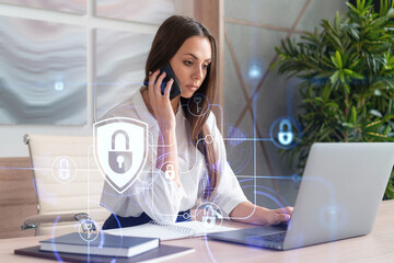 Attractive businesswoman in white shirt has conference call of cyber security in compliance division to protect clients confidential information. IT hologram lock icons over office background