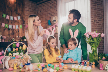 Poster - Portrait of attractive cheerful family drawing eggs having fun creative art hobby decor spending weekend time at loft home indoors