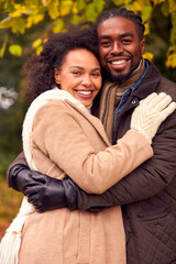 Wall Mural - Portrait Of Loving Couple On Walk Through Autumn Countryside Together