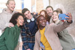 © Armando Oliveira - Multiracial young people group taking selfie with a smartphone - Happy lifestyle concept with young students having fun together - focus on black man.