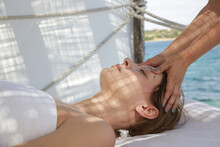 Woman Having Face Massage In Spa Tent On The Beach.	