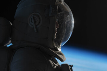 Wall Mural - cu portrait of caucasian female astronaut during spacewalk