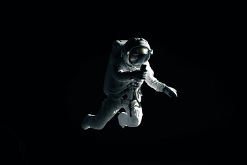 Caucasian female astronaut using her mobile phone during spacewalk, messaging, taking pictures