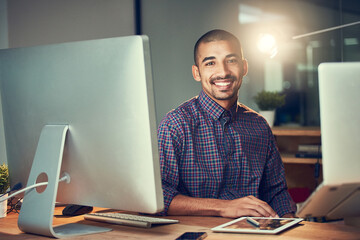 Aufkleber - Its about doing whatever it takes to be successful. Portrait of a young designer working late in an office.