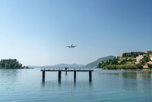 Greece, Corfu Island, Airplane Flying Above Sea