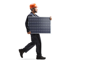 Wall Mural - Male worker walking and carrying a solar panel