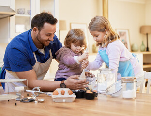 Sticker - The kitchen is the heart of the home. Shot of a young father baking together while a little girl stirs a bowl of cake batter.