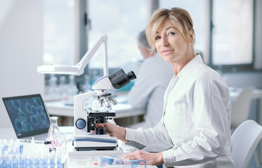 Wall Mural - smiling researcher working in the lab