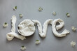 © Mila - word love with nest background for newborn and baby. Basket for newborn photo shoot.