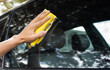 © kieferpix - Hand cleaning wiping car window