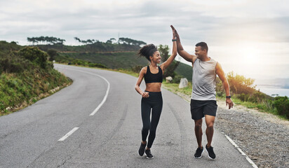 Poster - What an amazing run that was. Shot of a sporty young couple high fiving each other while exercising outdoors.