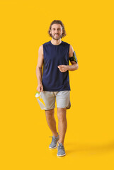 Sticker - Sporty man with bottle of water on orange background