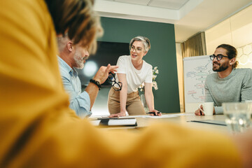 Wall Mural - Happy businesspeople having a discussion during a meeting