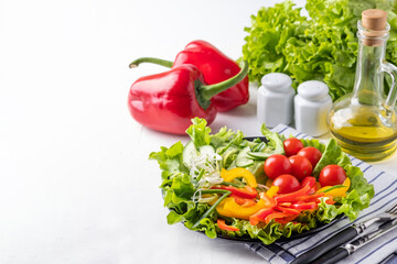 Wall Mural - Raw fresh vegetables on a plate. Diet food concept. Copy space