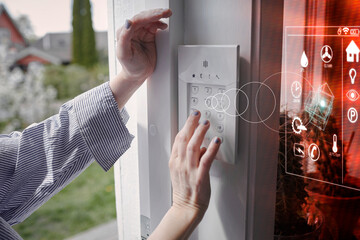 Woman using entry door keypad