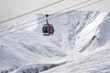 © bortnikau - Gondola (Ski Lift) against snow-covered Caucasus Mountains in Distance, Gudauri Ski Resort, Georgia