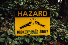 Yellow Hazard Sign. Broken Limbs Above