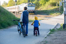 Children, Boy Brothers, Waiting On A Railroad Cross To Pass A Train