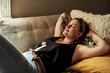 © Chanelle M/peopleimages.com - This is why weekends were invented. Shot of a young woman relaxing on the sofa at home.