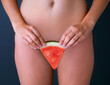 Fruitylicious lady bits. Cropped studio shot of a woman suggestively holding a slice of watermelon in front of her pelvic area.