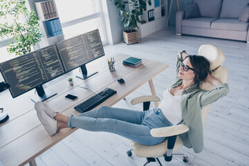 Wall Mural - Full size portrait of happy lady sit chair hands behind head legs on desk drowse daylight workstation