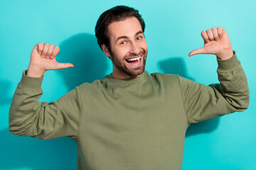 Wall Mural - Photo of hooray brunet young guy index himself wear green shirt isolated on teal color background