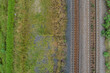 © Austockphoto - Top down view of railway line and grass beside train track