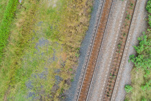 Top Down View Of Railway Line And Grass Beside Train Track