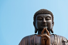 Wooden Buddha Statue Under Blue Sky