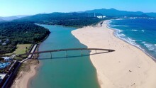 Aerial Panorama Shot Of Sandbank, River And Bridge During Sunny Day - Fulong Beach,Taiwan