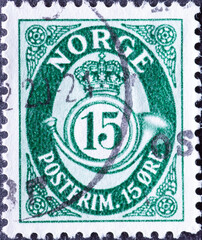 Wall Mural - Norway - circa 1950: a postage stamp from Norway , showing a post horn with crown and numeral 15 green