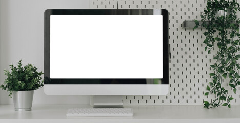 Wall Mural - Mockup blank screen laptop on desk. Workspace with laptop and office supplies.