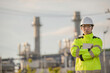 © reewungjunerr - Asian man petrochemical engineer working at oil and gas refinery plant industry factory,The people worker man engineer work control at power plant energy industry manufacturing