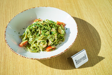 Canvas Print - pasta with pesto on the table