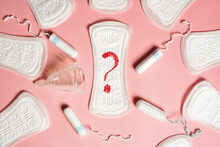 Pad, Menstrual Cup, Tampon On A Pink Background. The View Is Flat. Concept Of Critical Days, Menstruation