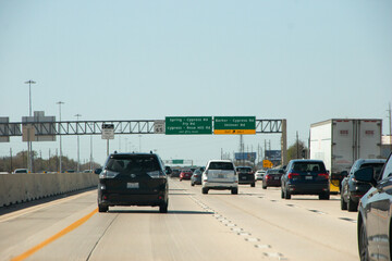 HOUSTON, TEXAS - March, 2022:  Traffic signs and signals all over the freeway road