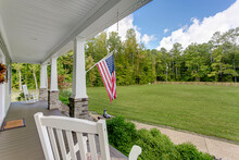Covered Porch Countryside Farmhouse American Flag Blue Sky Sunny Summer Usa