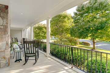 Covered porch luxury nature outdoors rocking chair country farmhouse fern cobblestone fall foliage