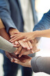 © Mikolette Moller/peopleimages.com - Achieving success as one. Cropped shot of a group of colleagues joining their hands in unity.
