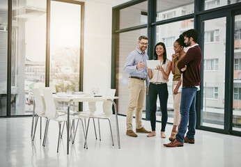 Poster - The smart team is a productive team. Shot of a group of colleagues having a meeting in a modern office.