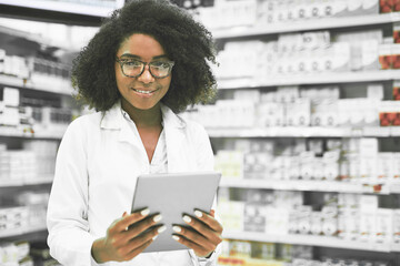 Poster - We make no mistakes. Portrait of a cheerful young female pharmacist standing with a digital tablet while looking at the camera in a pharmacy.