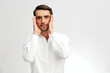 © SHOTPRIME STUDIO - handsome man white shirt posing holding on to the face emotions business and office concept
