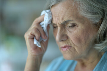 Sticker - Close up portrait of sick senior woman