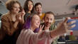 © iaginzburg - A group of five students are taking funny photos together, being in the auditorium in the university, slow motion
