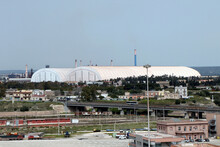 Acciaierie D'Italia (English: Steelworks Of Italy), Formerly ArcelorMittal, Ilva And Italsider. Long Cover Structure Required For The Environmental Containment Of The Mineral Park. Taranto, Puglia